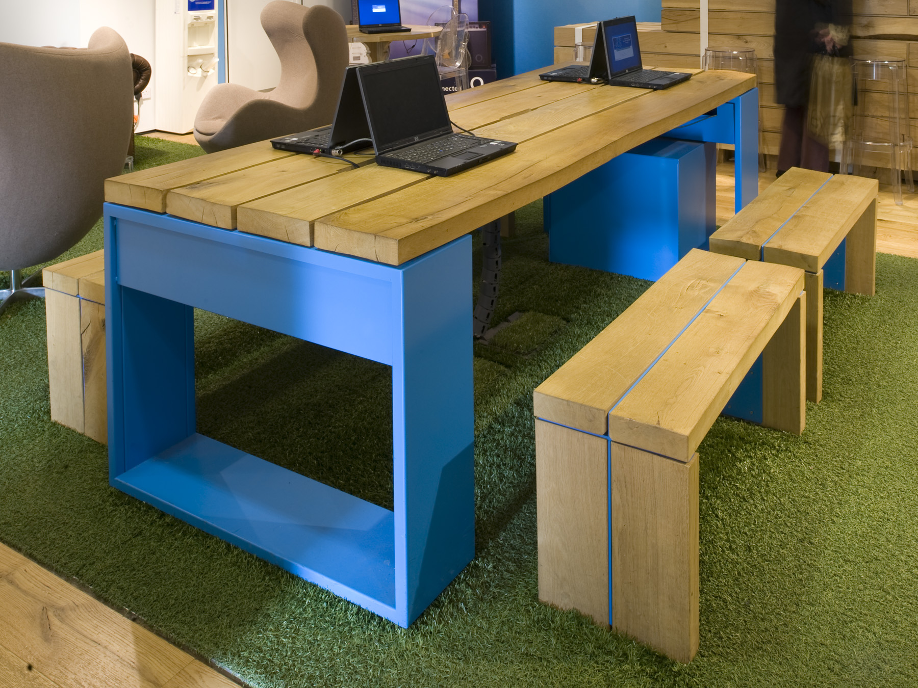 Custom furniture showcases technology integration and promotes interaction.