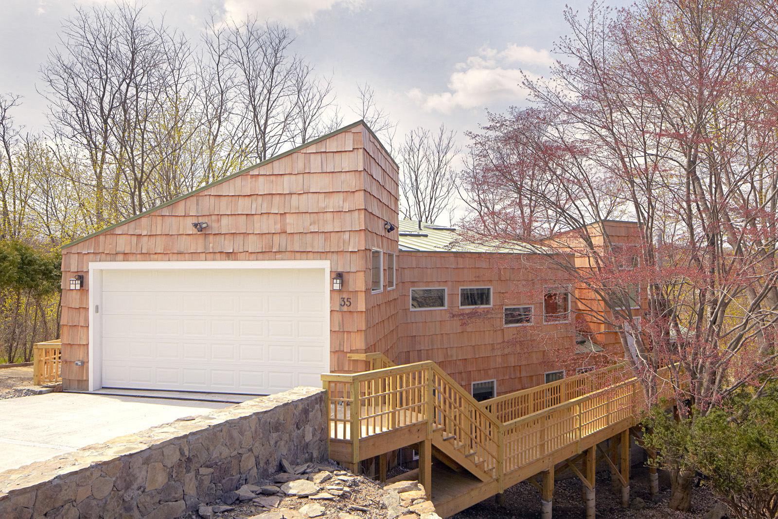 The updated roof line transformed the house from a split level ranch to a contem