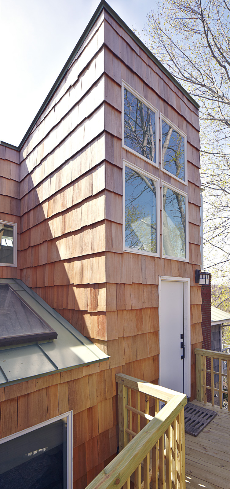 The main entrance is marked by the tall sloping roof of the stair tower.