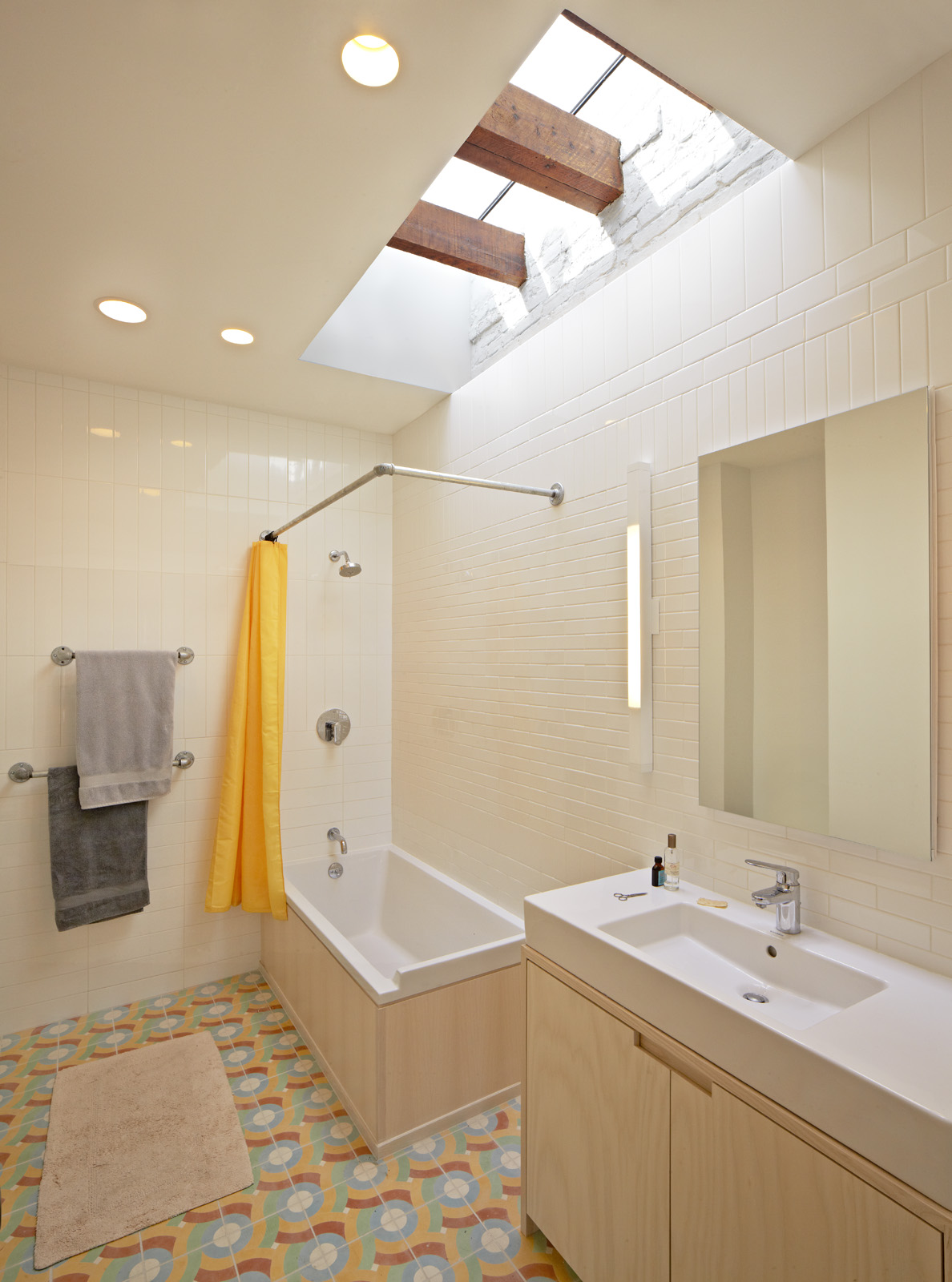 The master bath is flooded with light from above