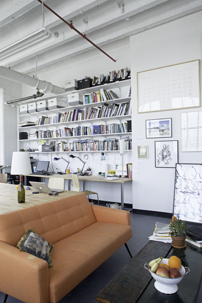 A wall of artifacts, books and posters 