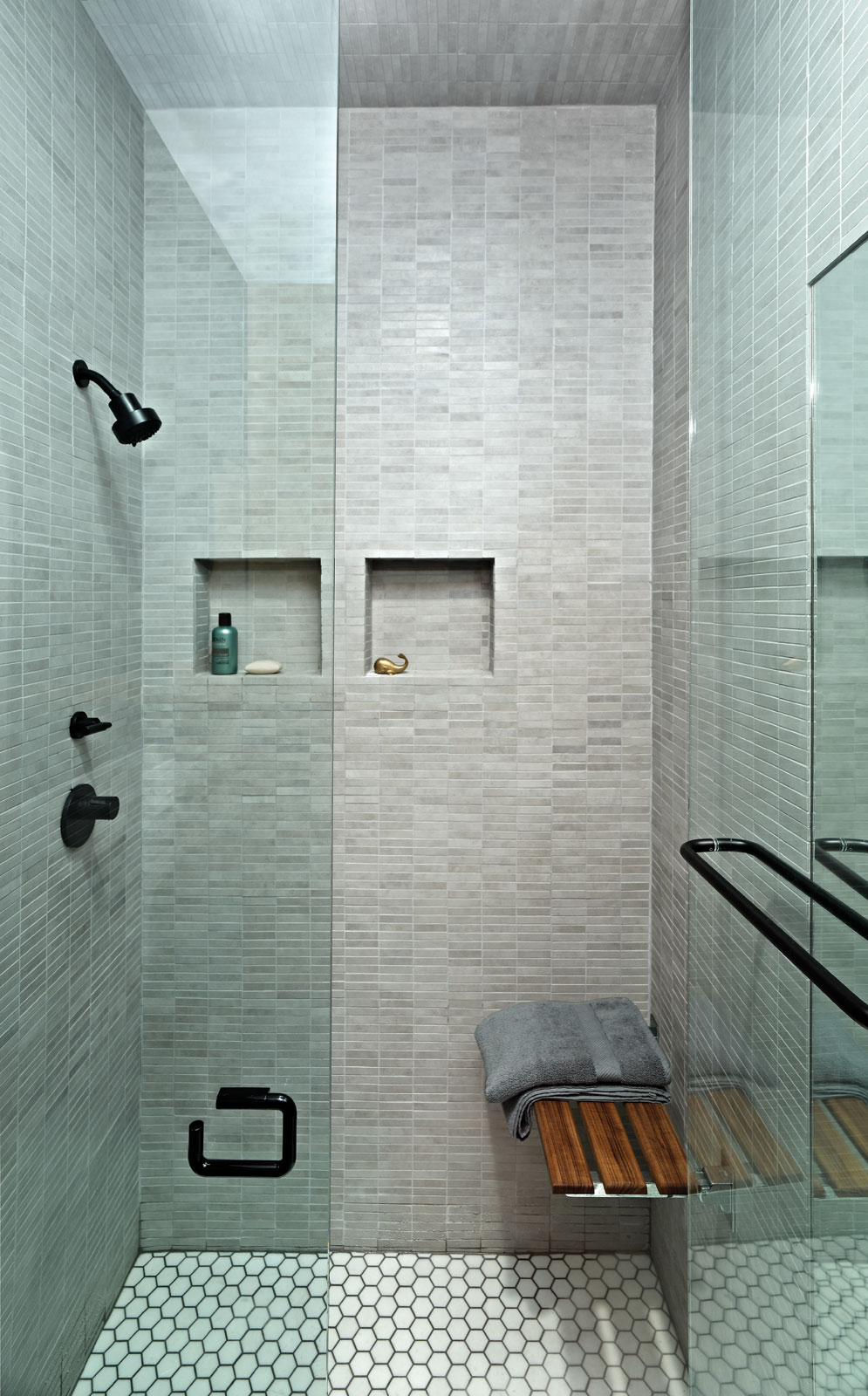 The bathroom showcases fixtures with a custom matte black powder-coat finish.