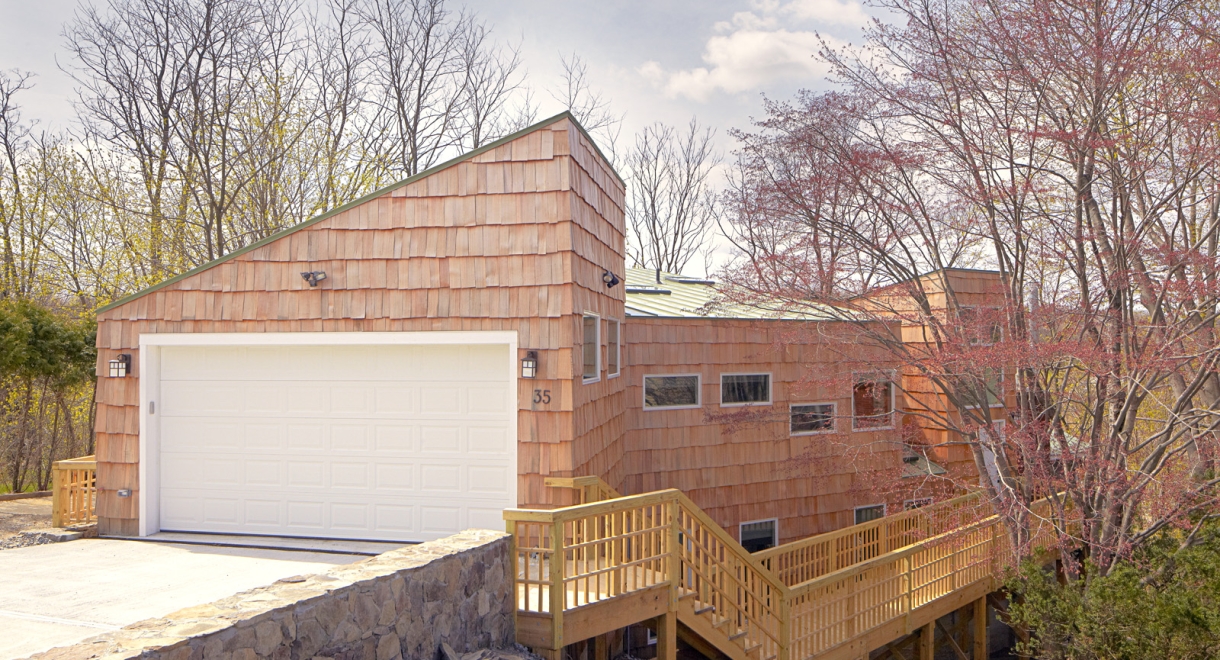 The updated roof line transformed the house from a split level ranch to a contem